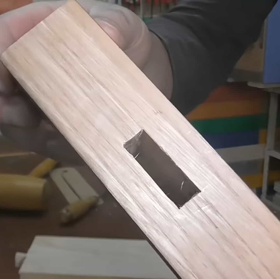 Demonstration of a rectangular hole in a wooden bar