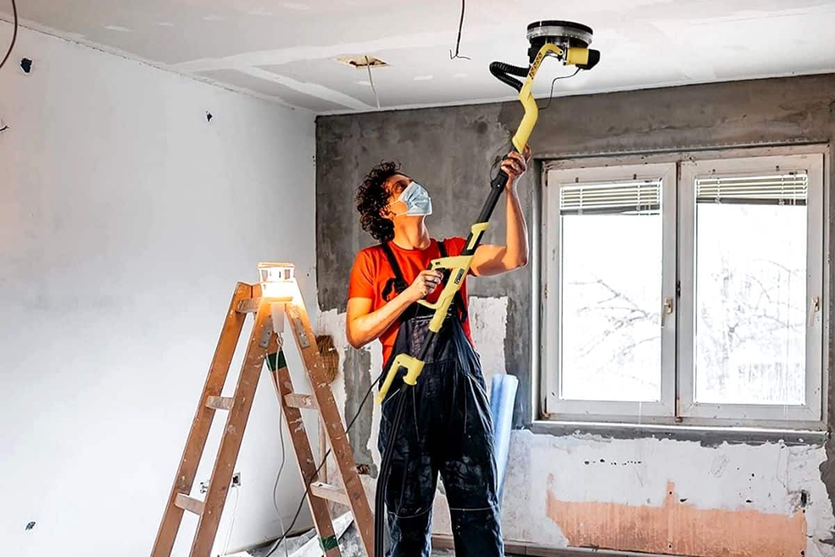Drywall sander in a working process