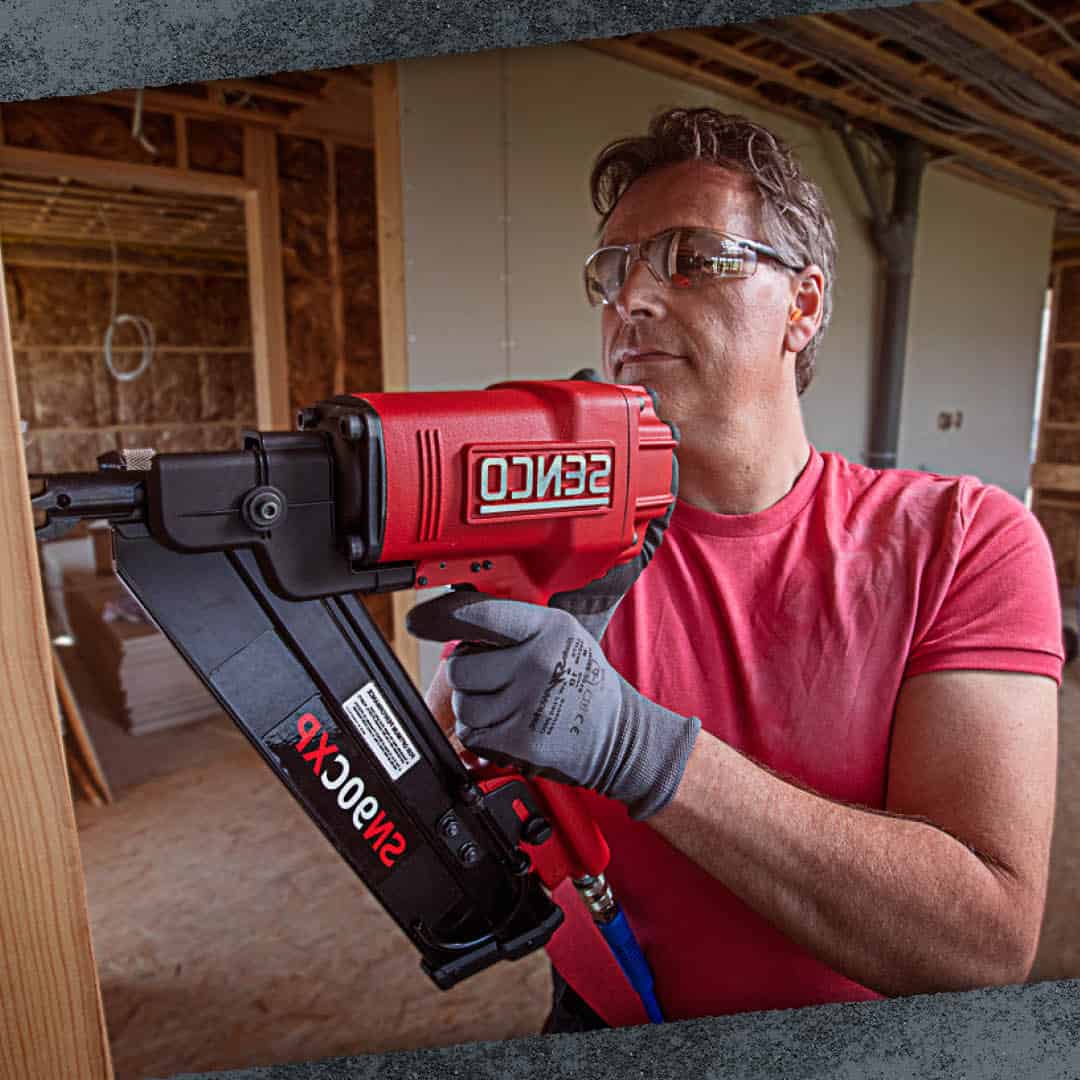 Handyman with a red nailer