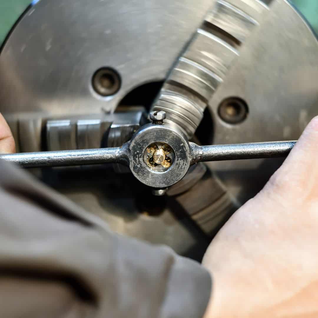 machine tapping a bronze stud with a die ona lathe